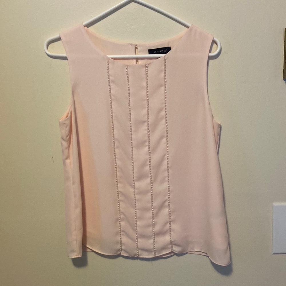 Pink satin and pearl sleeveless blouse.